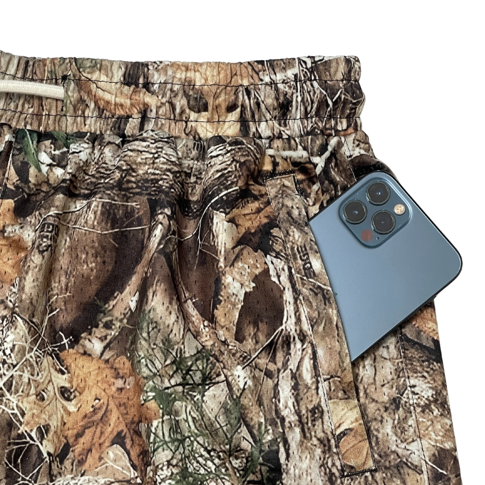 Silpaz men's brown timber camo shorts close-up of mesh fabric texture and side pocket