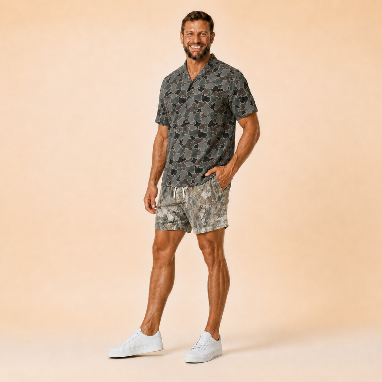 Man wearing Silpaz realistic camo mesh shorts with a dark camp shirt, full length walking pose