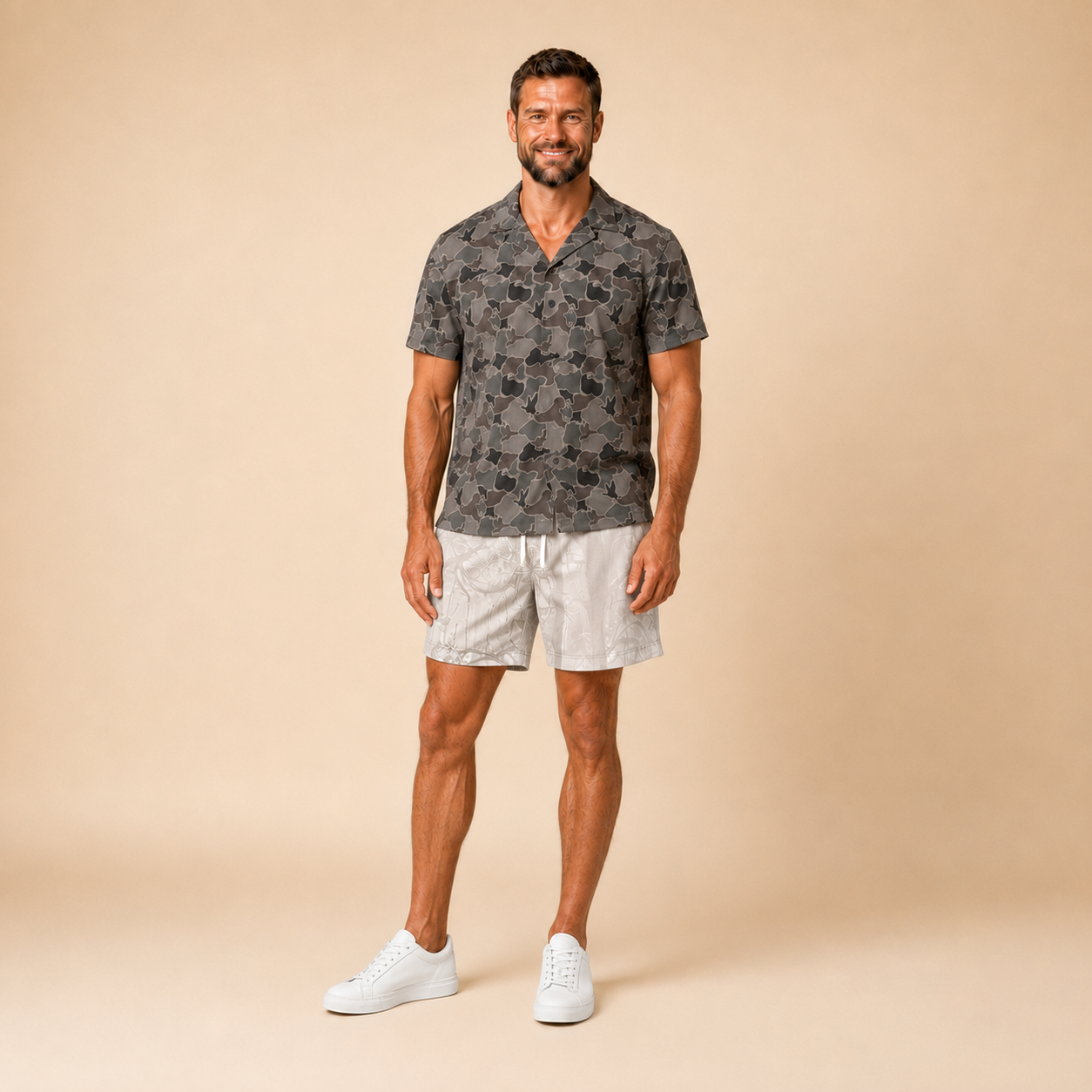 Man wearing Silpaz duck camo sport shorts in cream camo, standing front view