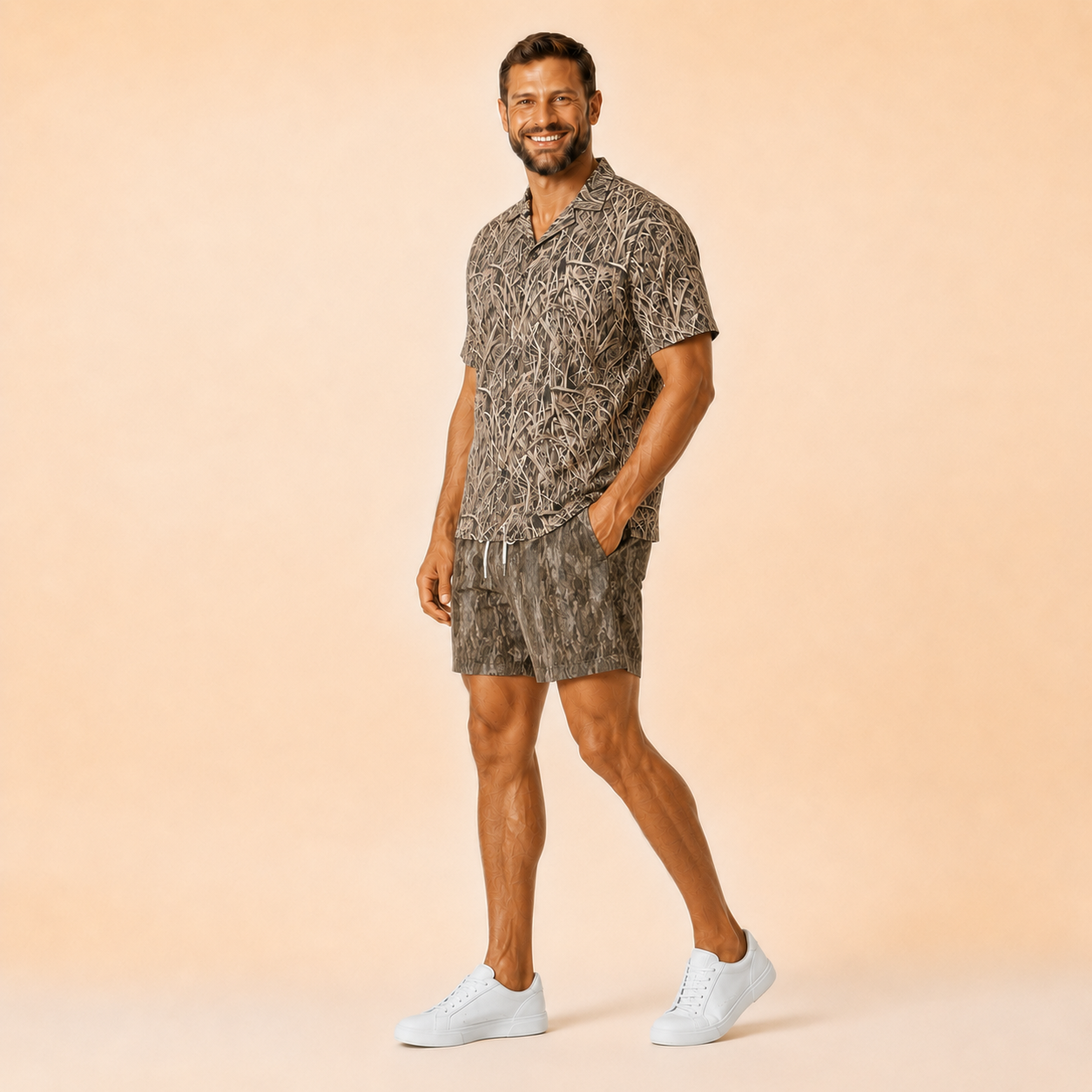 Man wearing Silpaz tree bark camo mesh shorts with a matching camp shirt, full length walking pose