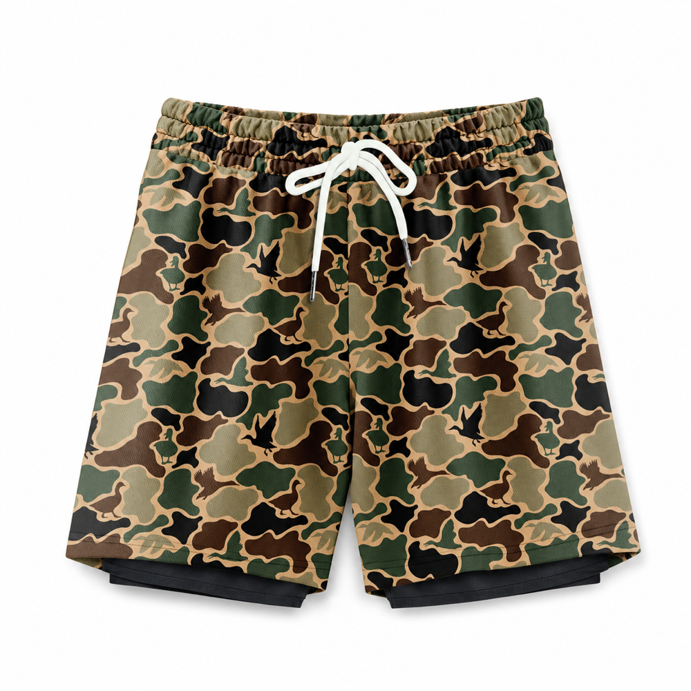 Silpaz men's green duck camo mesh shorts flat lay on a clean white background
