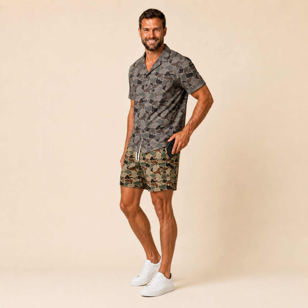Silpaz Men's Vintage Duck Camo Shorts in Green Duck Camo - three quarter side view with phone at the side pocket