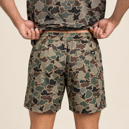 Silpaz Men's Duck Camo Athletic Shorts – Brown Duck Camo — close-up of the back waistband, welt pocket and brand tab