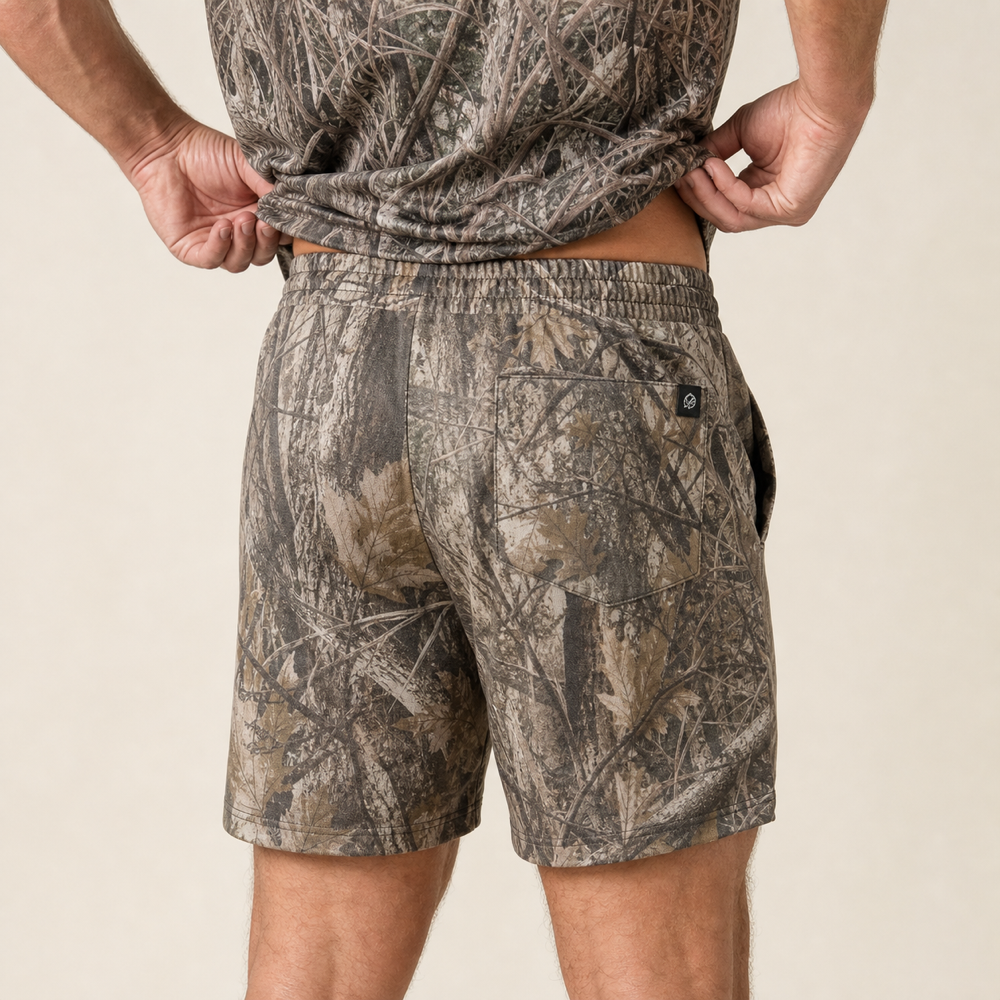 Silpaz Men's Realistic Camo Mesh Shorts – Tan Leaf Camo — close-up of the back waistband, welt pocket and brand tab