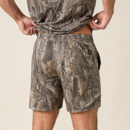 Silpaz Men's Realistic Camo Mesh Shorts – Tan Leaf Camo — close-up of the back waistband, welt pocket and brand tab