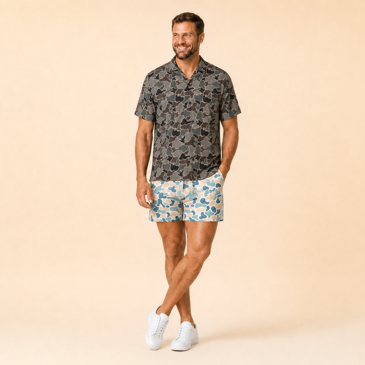 Man wearing Silpaz duck camo athletic shorts in light blue camo, standing front view